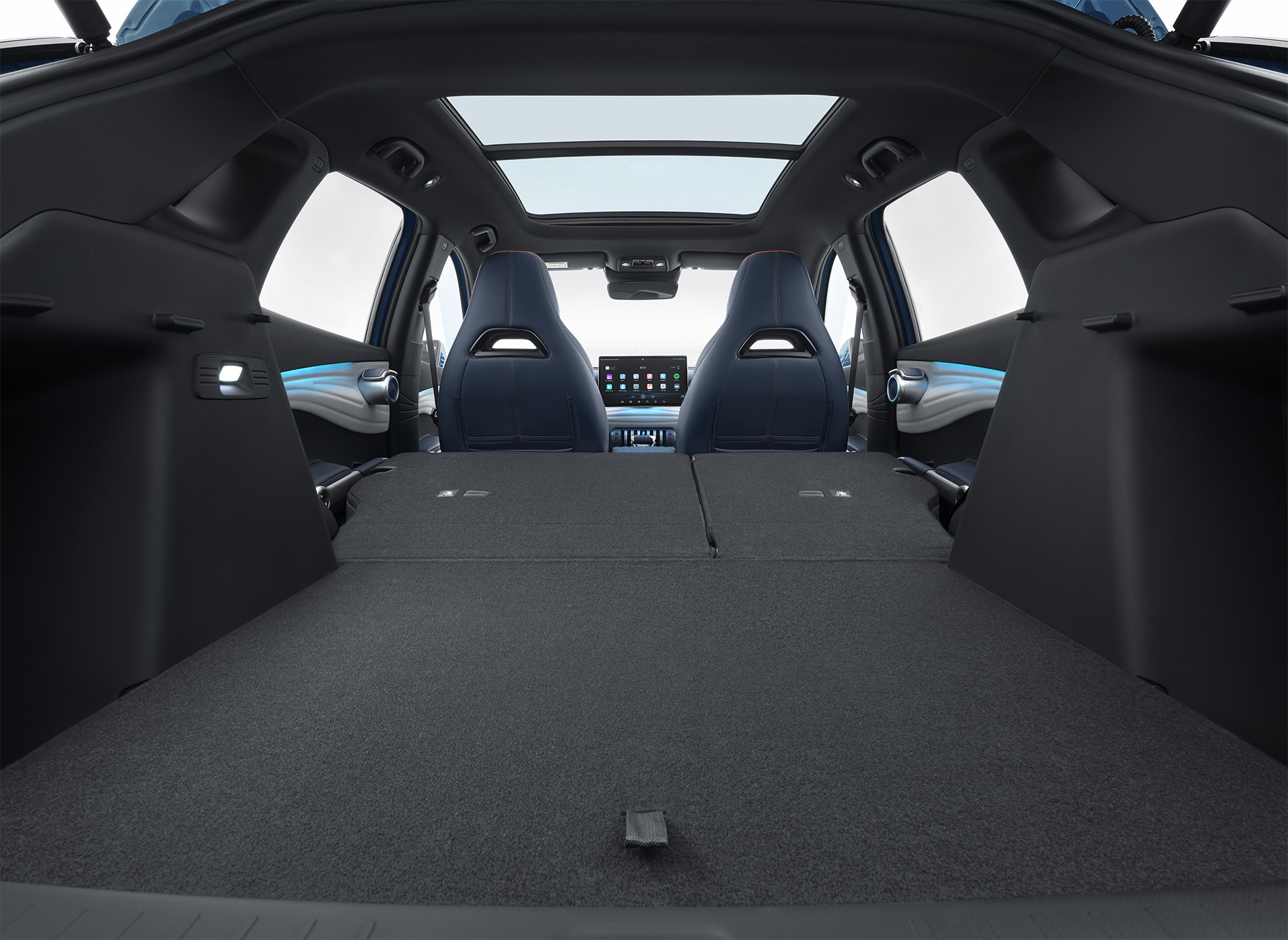 A photograph of the interior of the BYD Atto 3 showing the boot space with the rear seats folded flat